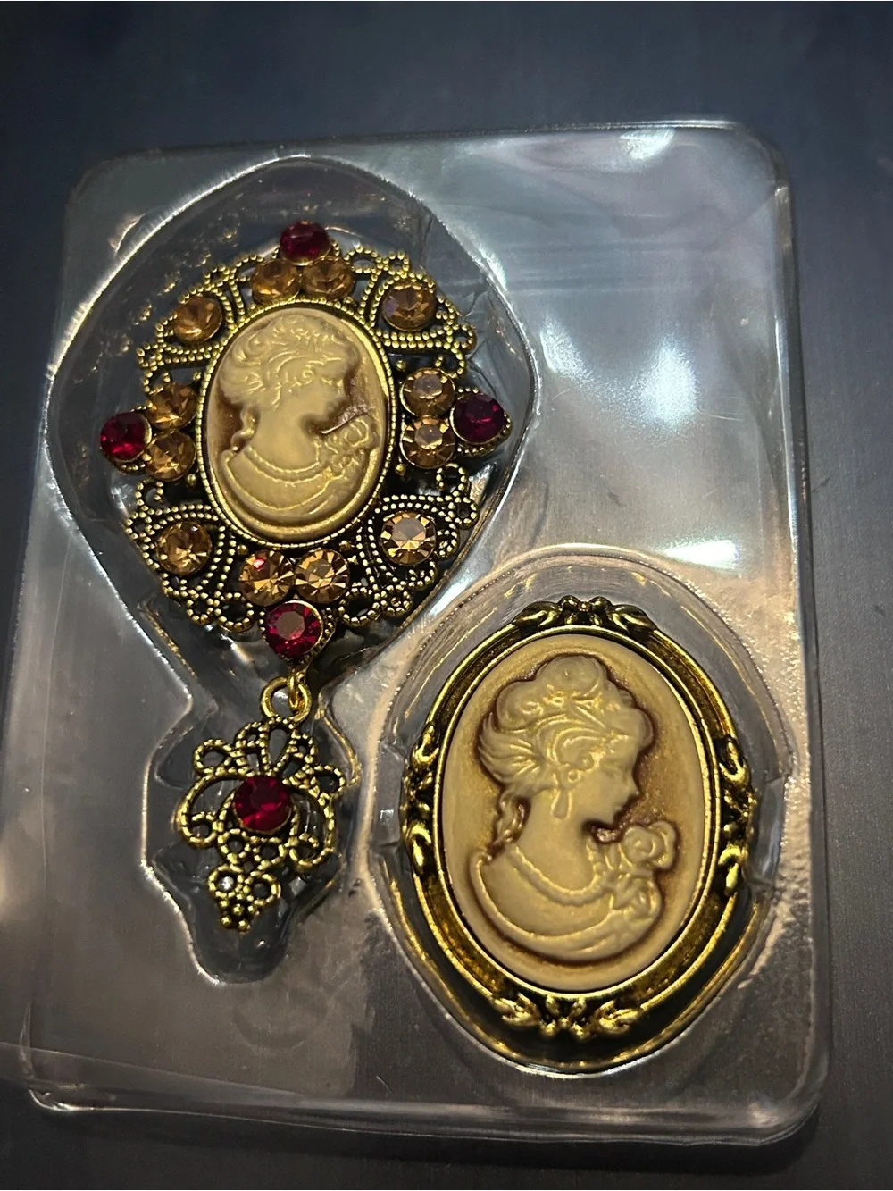 Gold-Tone Cameo Brooch Set with Ruby and Amber Accents